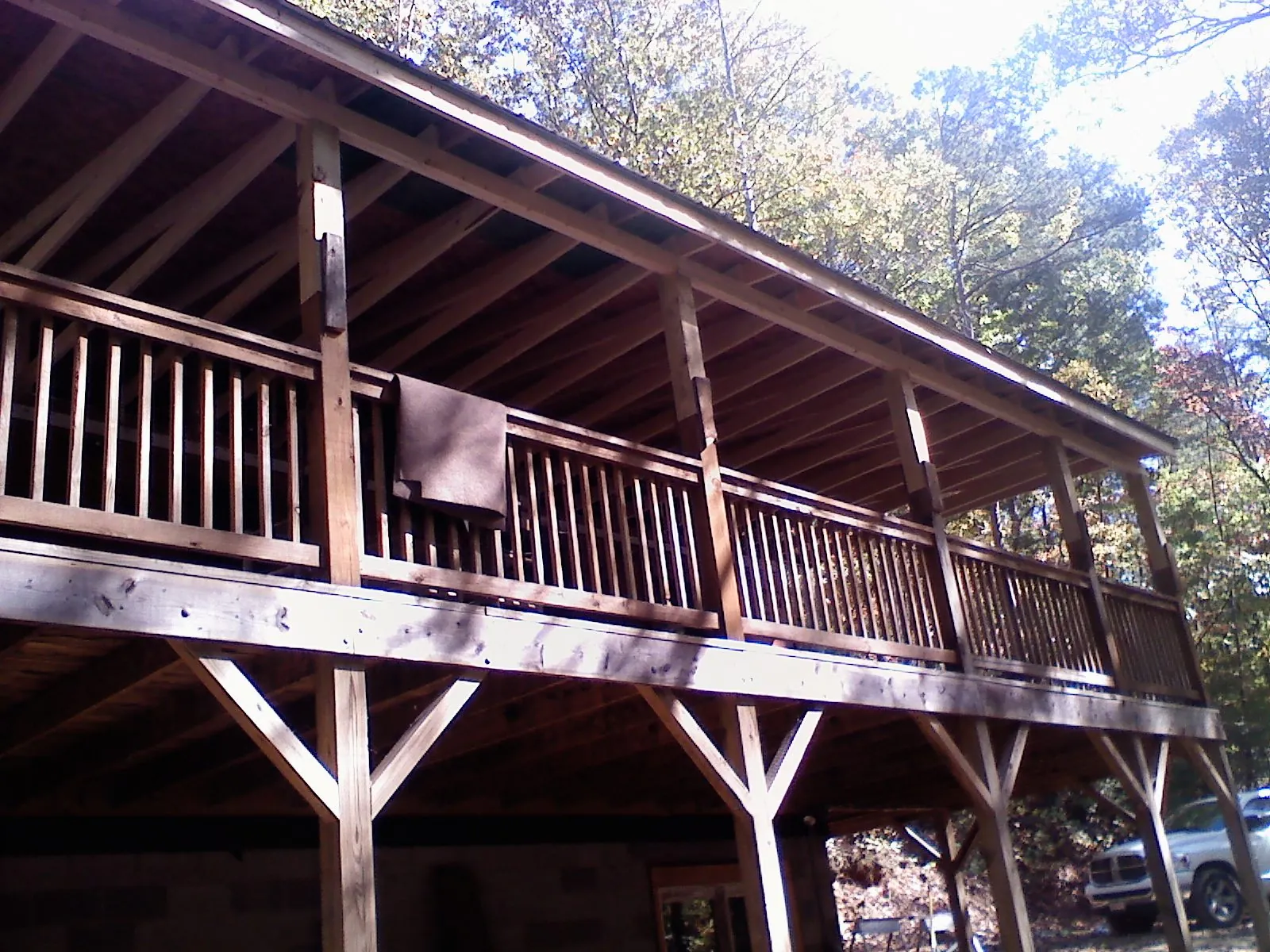 Timber framing under a new elevated porch and deck — Roof Leak Repair in Baldwinville by Roofing Brothers